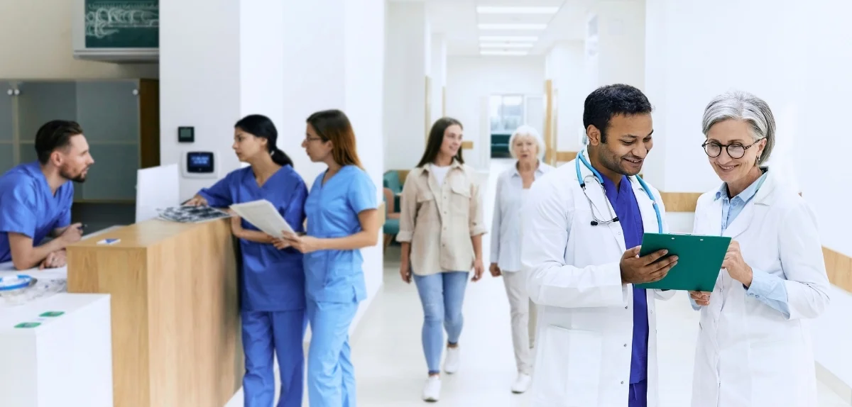 Healthcare professionals reviewing documents in a clinical setting