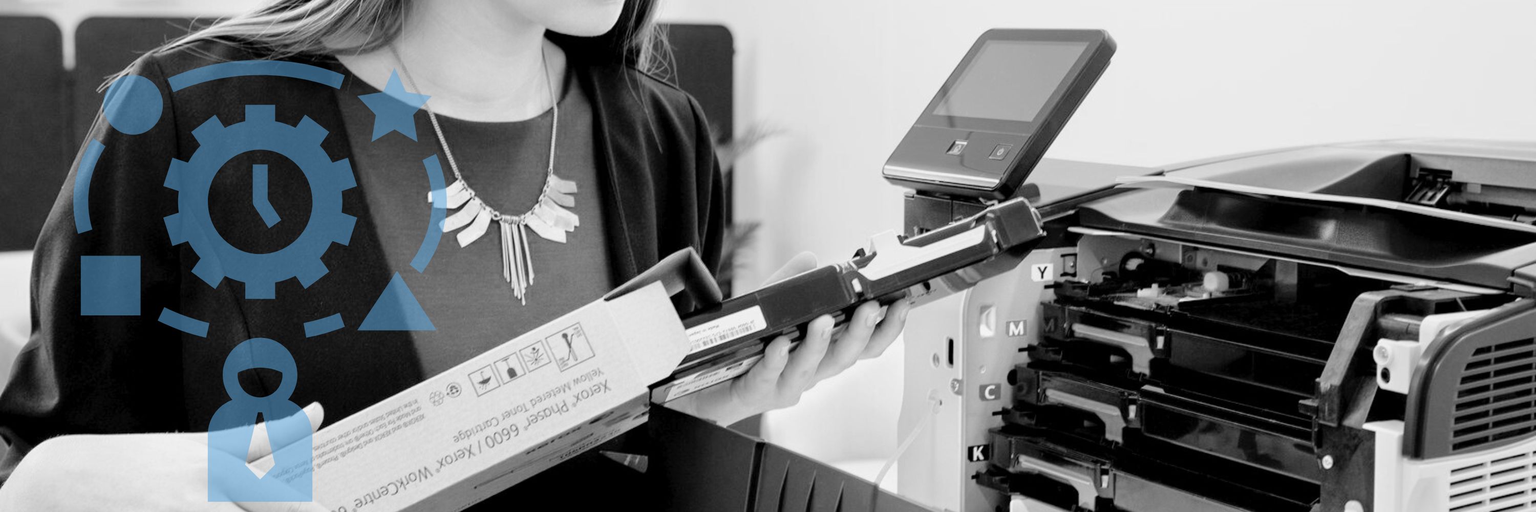 A woman holding printer toner cartridges