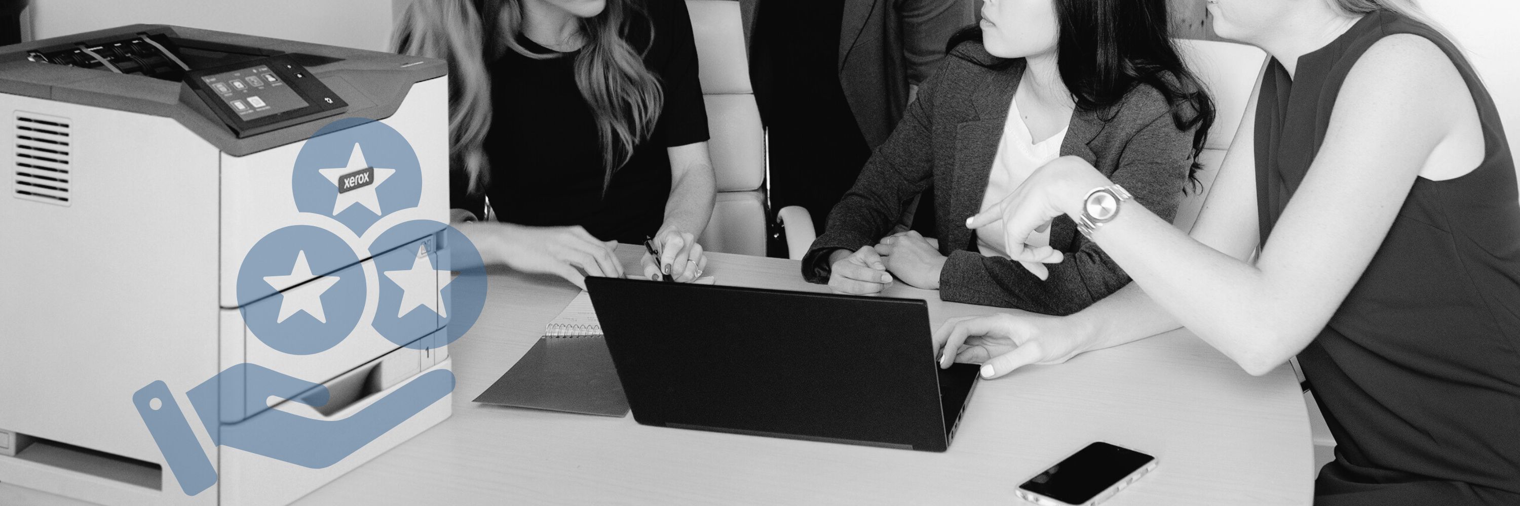 Women working near a Xerox printer