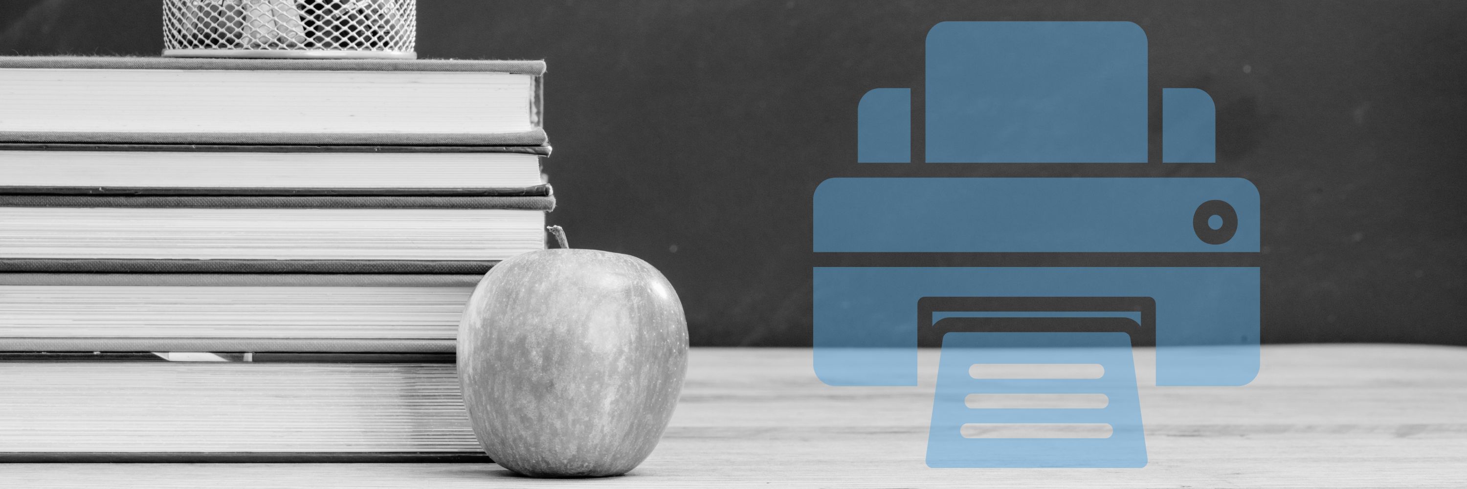 A school blackboard and a desk with an apple and books