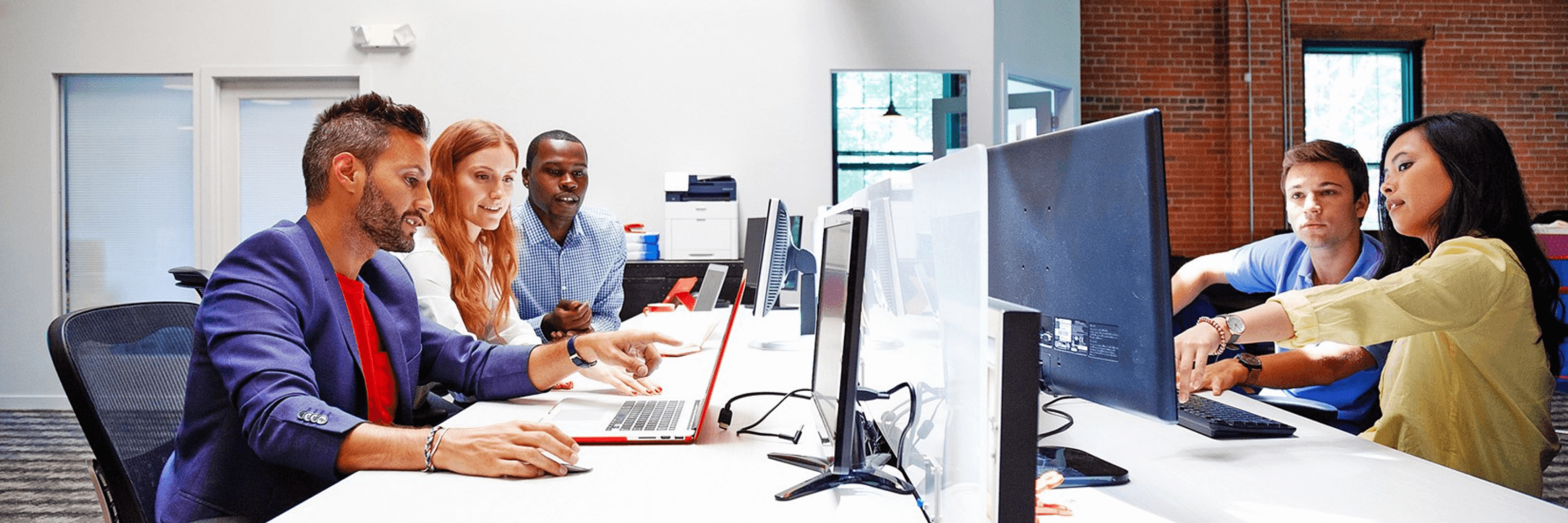 Work group with printer in the background 