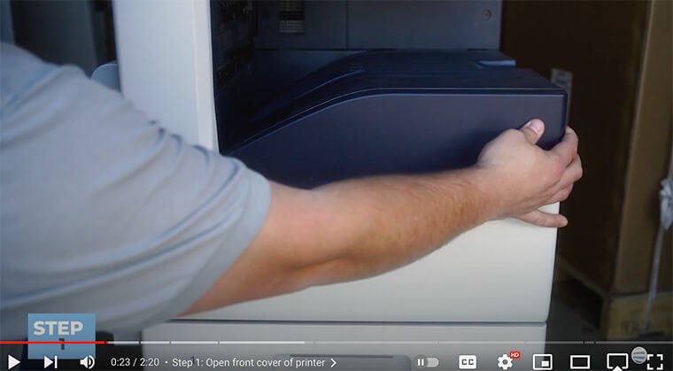 Printer technician opens front cover of Xerox VersaLink C7000 Series printer
