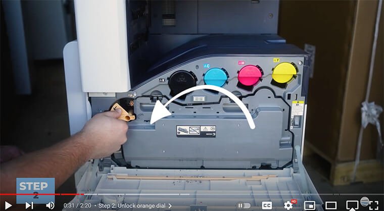 Printer technician unlocks orange dial on Xerox VersaLink C7000 Series printer
