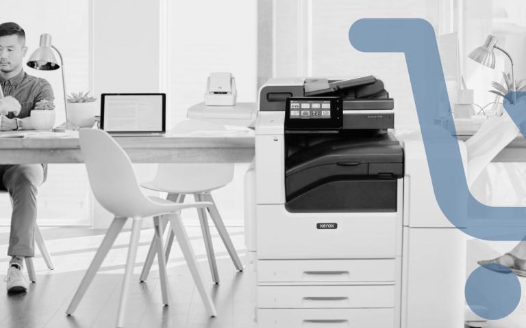 An office setting with a Xerox printer up front