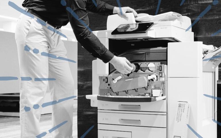 Man replacing toner on a laser printer