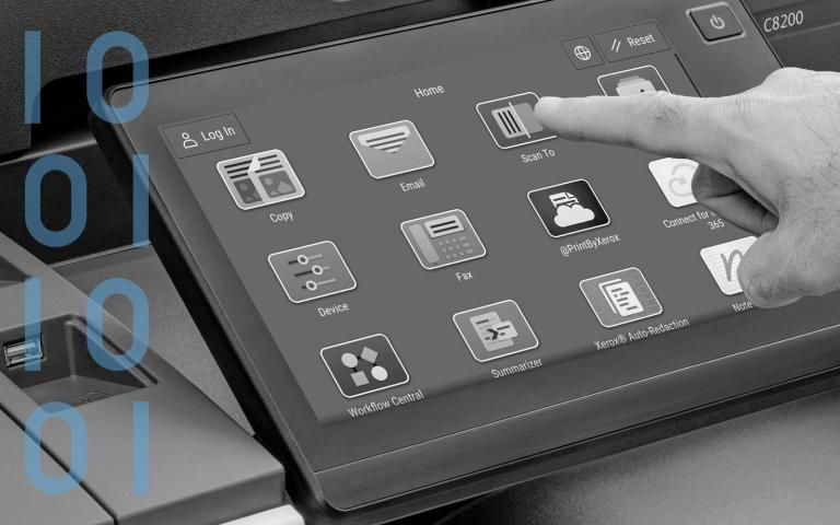 Hand touching Xerox printer touchscreen with apps