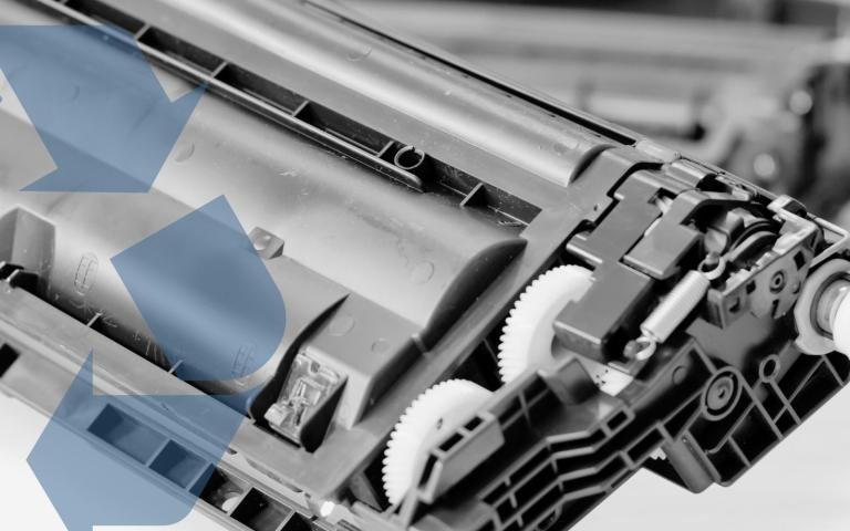 A person holds a laser printer toner cartridge