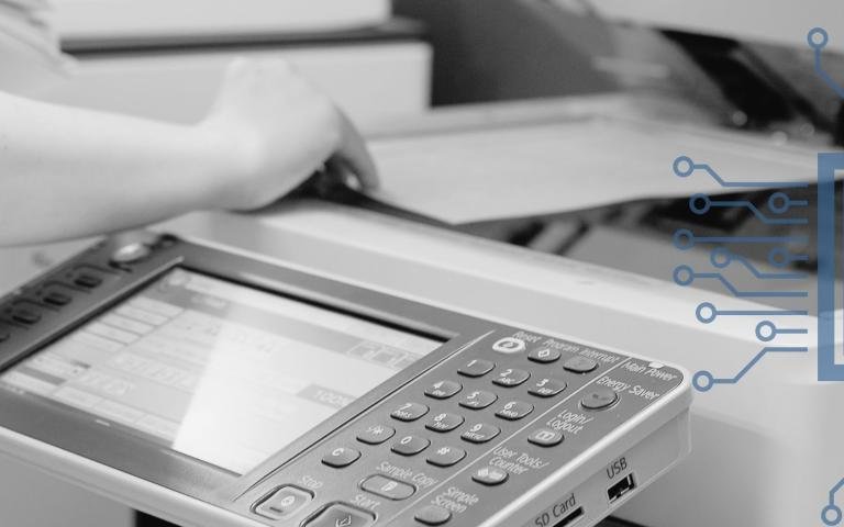 Woman using a color laser printer