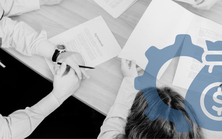 People working at a law firm sitting on table with documents