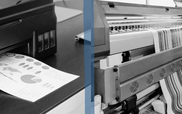 An office printer and a production printer side by side printing material