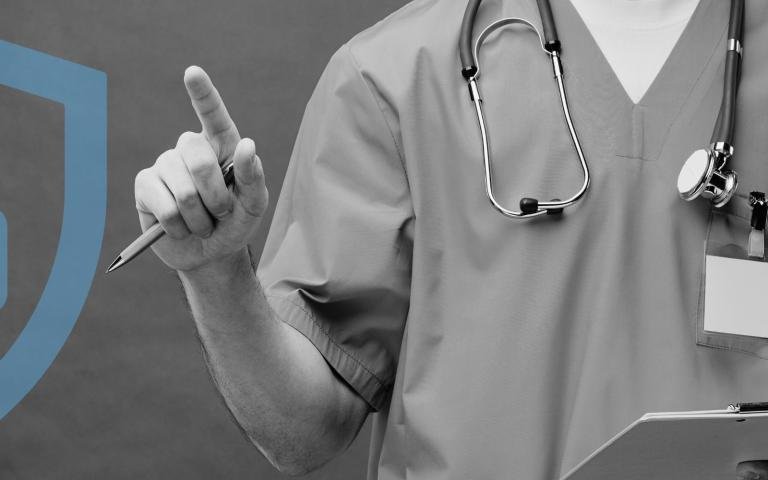 A healthcare staff point their finger upwards with a graphic overlay of a security lock