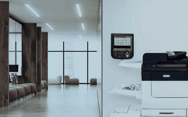 Xerox PrimeLink C9065 next to a wall in an empty hallway