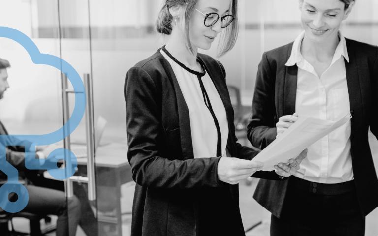 Office workers in front of a printer