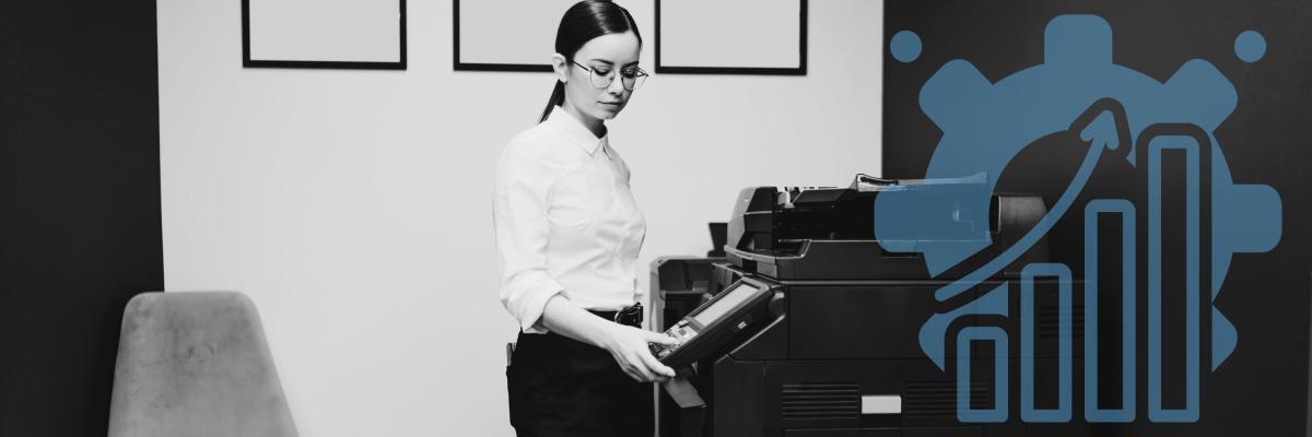 A woman using a printer in an office setting