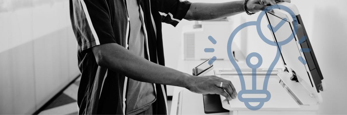 Man opening the scanner on a printer