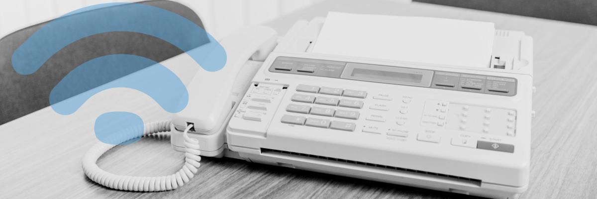 A fax machine sitting on an office table