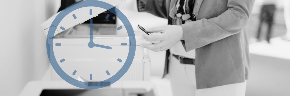 Person using a printer in an office environment