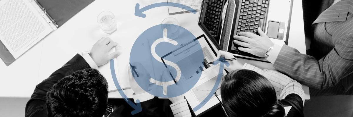 Business workers gathered around a table