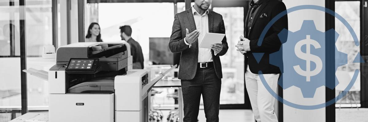 People holding papers in front of a printer