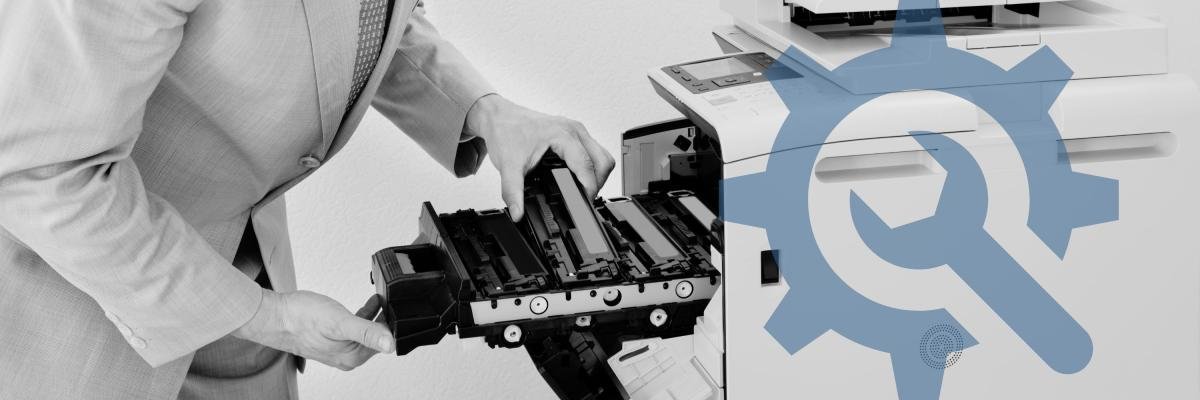 Man replacing toner on a copier