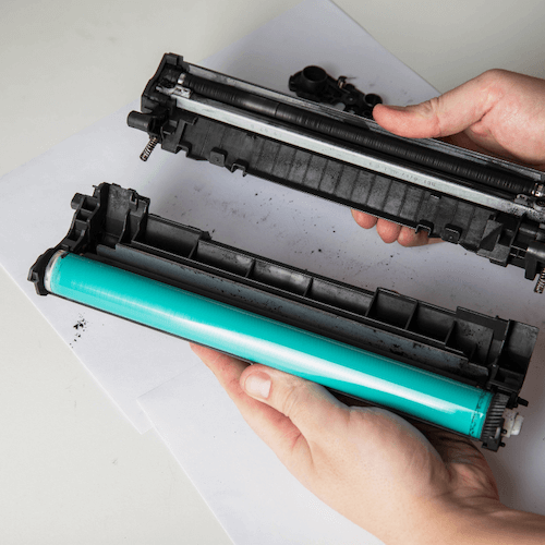 A laser printer toner cartridge gets pulled apart