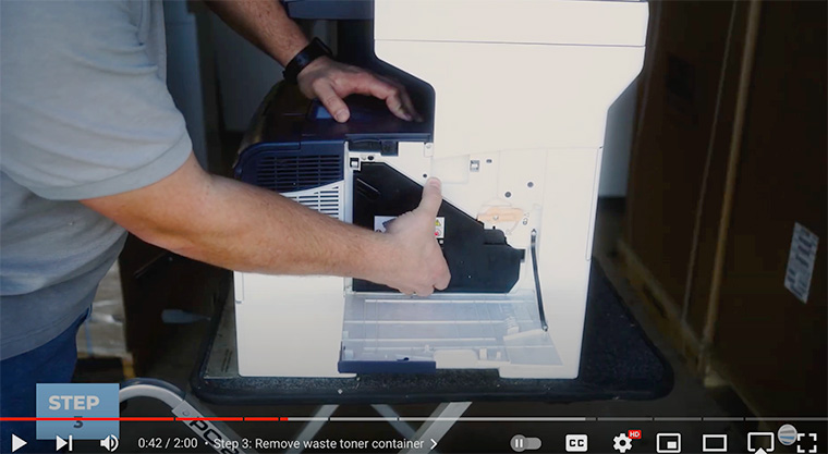 Printer technician removes waste toner container on Xerox VersaLink C400/C405