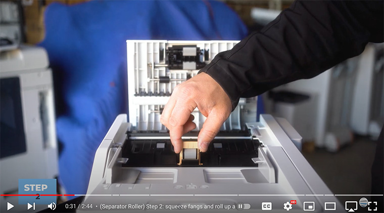 Printer technician removes separator roll of Xerox VersaLink C410/C415