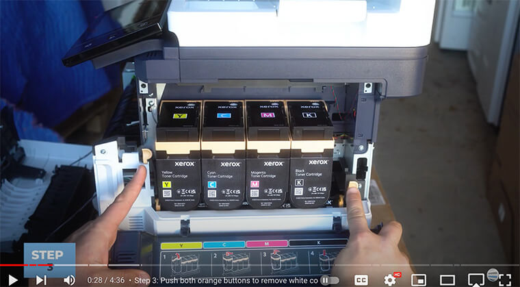 Printer technician presses buttons to remove side cover of Xerox C410/C415 printer