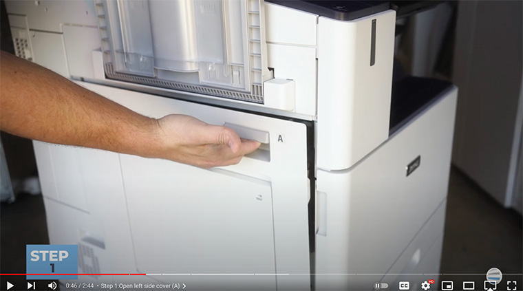Printer technician opens left side cover of Xerox AltaLink printer