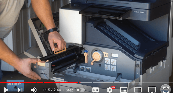 Printer technician inserts new cartridge on the Xerox AltaLink B8090 Printer