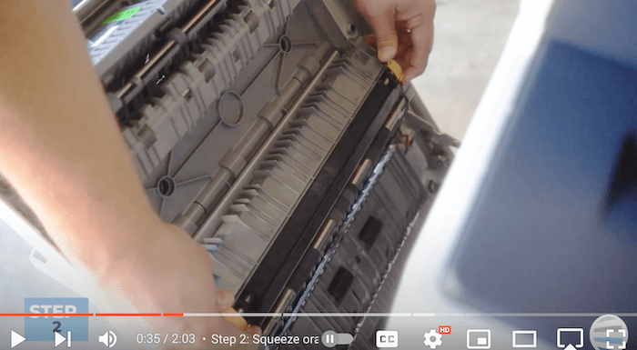 Printer technician removes the old transfer roller on the Xerox AltaLink B8090
