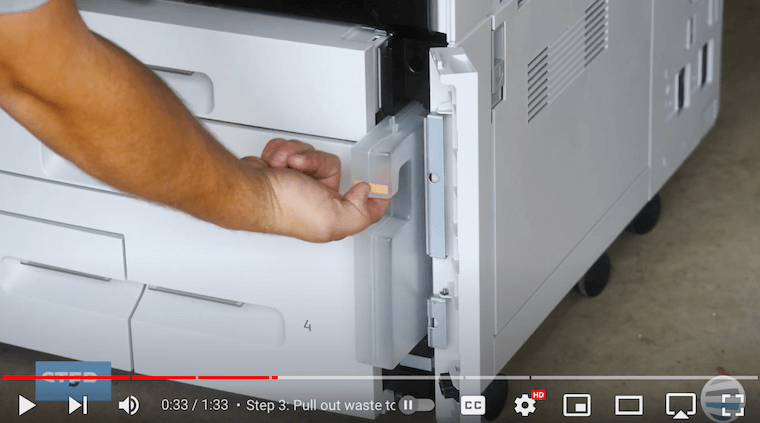 Printer technician pulls out waste toner container on Xerox PrimeLink C9065