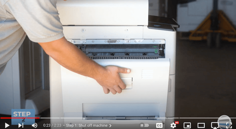 Printer technician opens the left side cover on a Xerox AltaLink B8090 Printer