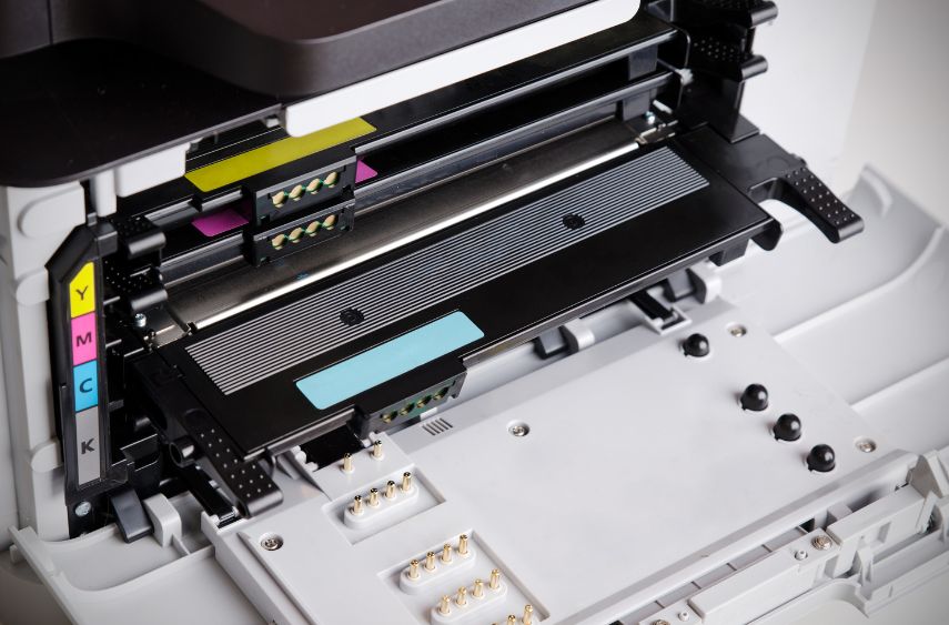 Inside a printer exposing toner cartridges