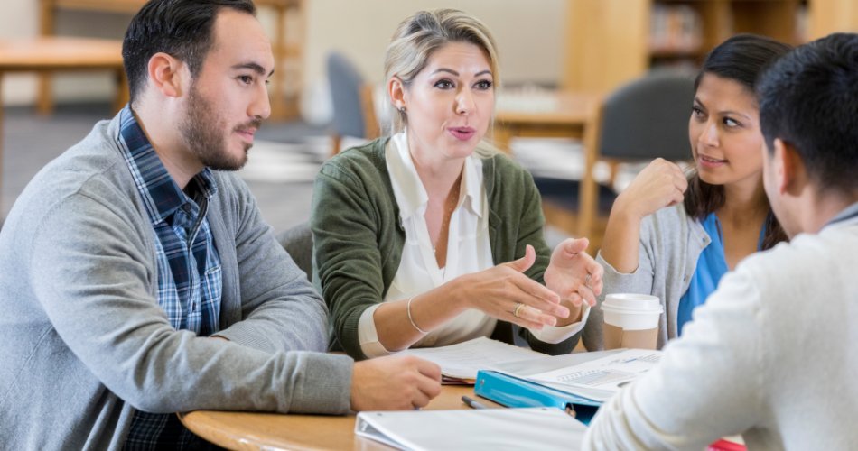 School leaders discussing a plan over a table